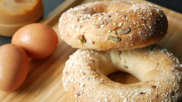 bagel and paper packet on white background 