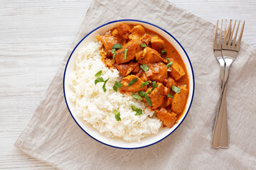 Homemade Easy Indian Butter Chicken with Rice on a Plate, top view. Flat lay, overhead, from above.