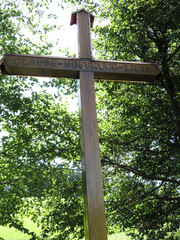 Large wooden cross with the inscription Faith Hope Love.