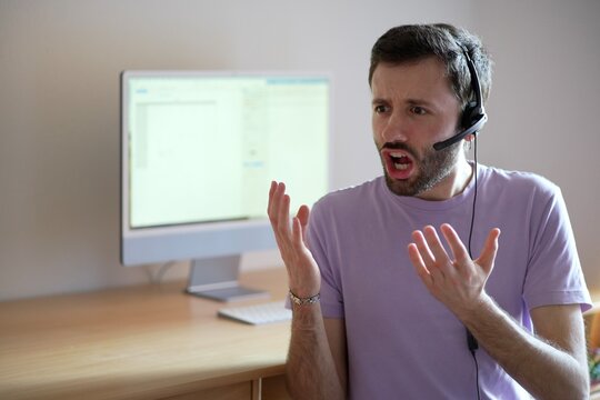 Angry and stressed customer service representative handling a challenging customer situation.