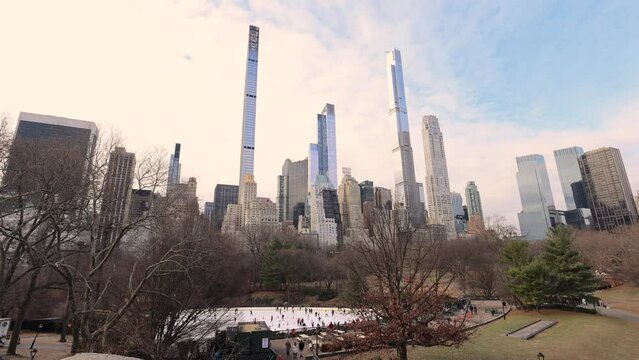 The city of New York in the USA, in Central Park the urban park in New York City located at the Upper West and Upper East Sides of Manhattan, showing The Steinway Tower the worlds skinniest skyscraper