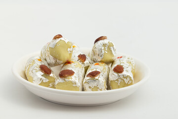 Indian Mithai Kaju Khoya Badam Roll Made Of Cashews, Khoa, Mawa, Kesar, Mava, Elaichi, Almond, Malai Is Enjoyed On Holi, Diwali, Rakshabandhan, Janmashtami, Navaratri, Puja, Rakhi, Makar Sankranti