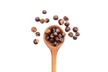 Guarana seeds in a wooden spoon isolated on transparent background. PNG