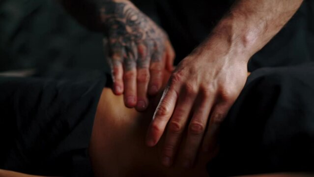 Anti-cellulite abdominal massage, professional masseur uses oil for massage