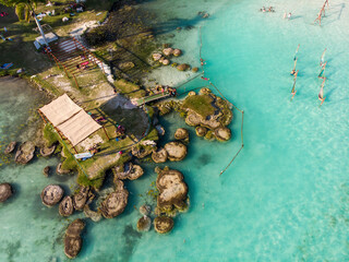 Aerial Drone Shot of Ancient Stromatolites in seven colores lagoon near Bacalar, Quintana Roo,...