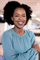 Portrait of happy african american businesswoman in modern office