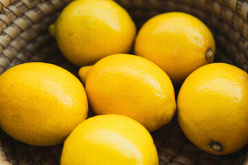 yellow fresh lemons on a wooden table