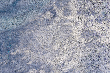 Blue and white stained concrete wall background texture