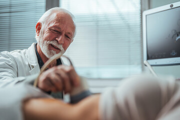 Doctor and patient. Ultrasound equipment. Diagnostics. Sonography. Sonographer using ultrasound...