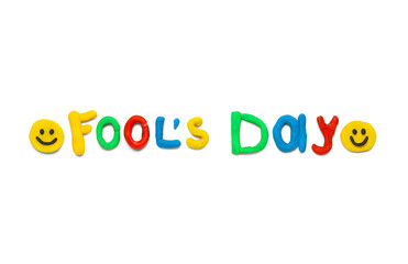 Text FOOL'S DAY made of plasticine on light background