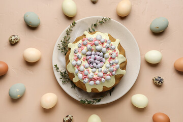 Composition with tasty Easter cake, eucalyptus branches and eggs on color background