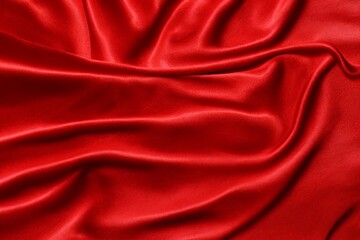 Fototapeta na wymiar Draped red silk fabric background texture