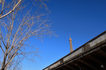 Fototapeta na wymiar Paris, France. The Eiffel Tower seen through the wall. February 6, 2023.