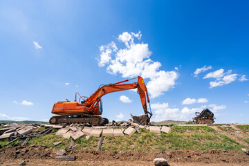 The excavator is under the blue sky