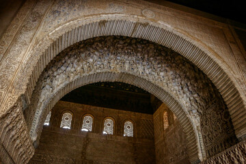 Close-up details of decorative carvings at Alhambra, a palace and fortress complex in Granada