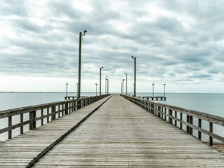 Fototapeta na wymiar A wide empty pier with street lights