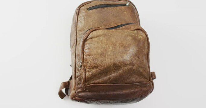 Brown camping rucksack and copy space on white background