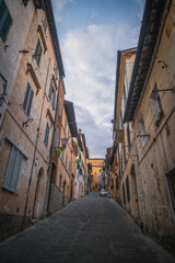 Fototapeta na wymiar Old medieval streets of Siena, Tuscany, Italy. Siena architecture and landmark. Picturesque streets of Siena, Italy.Travel destination of Italy and Siena. October 2022
