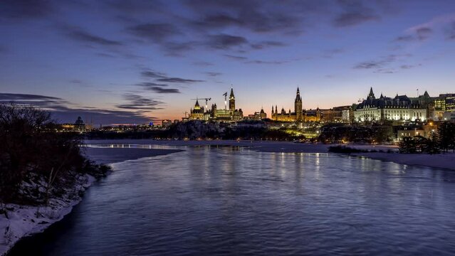 4k holy grail night to day timelapse taken from Majors Hill Park in downtown Ottawa Canada with view to the historical buildings of the Canadian parliament and its surroundings.