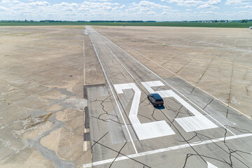 Aerial Shot of Old Abandoned concrete airstrip in the midwest