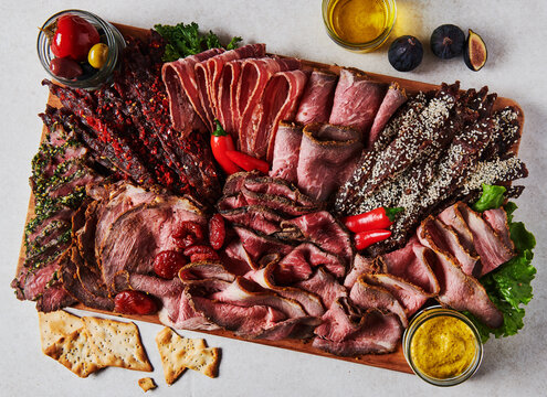 Charcuterie board with assorted meats