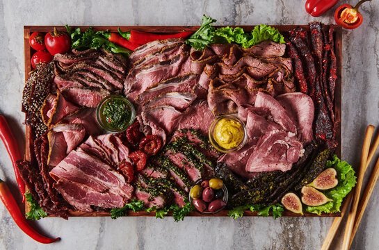 Charcuterie board with assorted meats