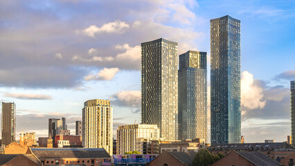 city skyline at sunset with three bulidings in Manchester