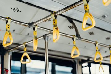 Yellow handrails inside the bus
