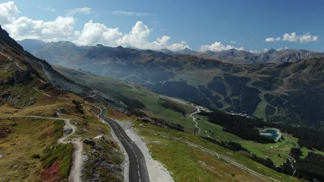 Breathtaking landscape of French Alps during summer season, Col de la Loze with Blue lake in valley background. Aerial drone panoramic view