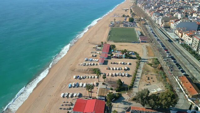Aerial images of Pineda de Mar beach in Barcelona showcase its stunning beauty and crystal clear waters.