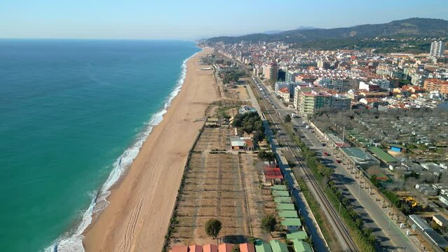 Aerial videography of Pineda de Mar beach captures the stunning beauty of this vibrant coastal town. From up above, one can see the pristine beaches, the scenic coastline and the lively atmosphere.