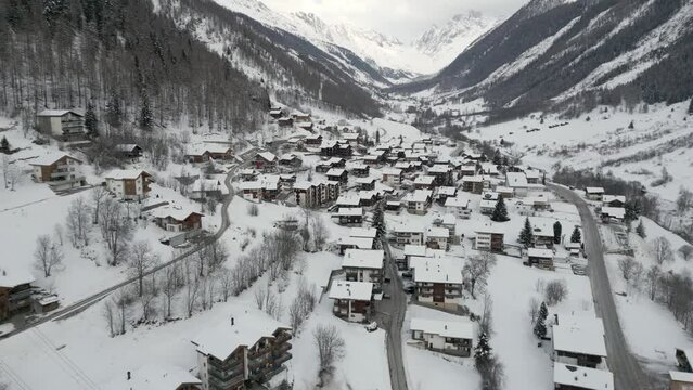 Aerial shot of a small mountain village Wiler in L&ouml;tsch valley in Switzerland. Everything is snowy, winter landscape