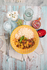 Picante de carne beef stew with potatoes Assorted food plates Peru traditional comfort food buffet table