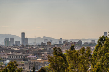 Beautiful view of the large Mexican city of Puebla. View of the endless mountain peaks around the city.