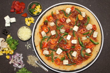 Indian Pizza with Paneer (Indian Cottage Cheese), Paparika and Capsicum
