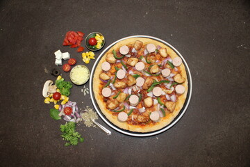 Indian style Pizza with Chicken, Sausage and Vegetables
