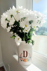 White flowers in an Initial Vase