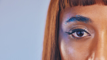 Festival makeup, glitter eyeshadow and eye portrait of a black woman with cosmetics and mockup. Creative cosmetic, eyebrow sparkle and microblading of a model with eyeliner and studio mock up - obrazy, fototapety, plakaty