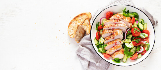 Salad with chicken meat. Fresh vegetable salad with chicken breast. Meat salad with chicken fillet and fresh vegetables on plate.