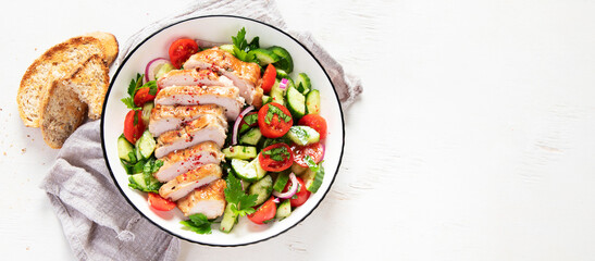 Salad with chicken meat. Fresh vegetable salad with chicken breast. Meat salad with chicken fillet and fresh vegetables on plate.