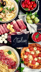 Italian food dishes on dark background.