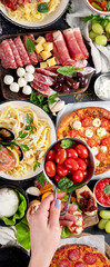 Italian food dishes on dark background.