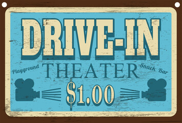 Vintage retro drive-in theater sign on wood grain texture