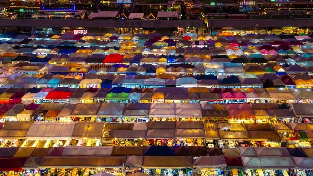 Dusk to night timelapse of Asian night market, Bangkok, Thailand. 