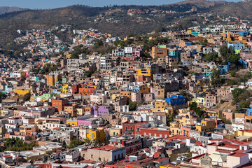 Very beautiful view of the city at sunset in the Mexican city of Guanajuato surrounded by large mountains.