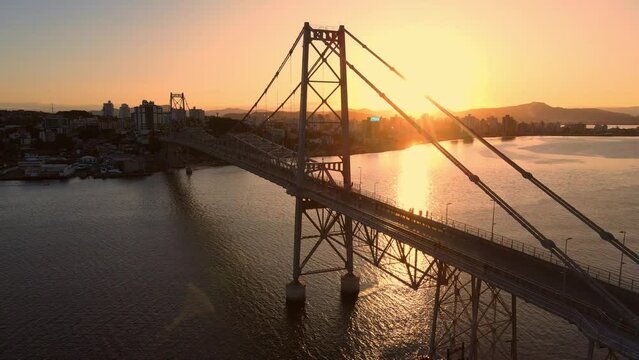 Hercilio luz bridge with city and sunset in Florianopolis, Brazil. Aerial view
