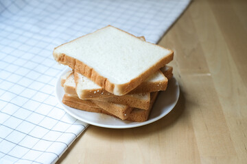 Sliced bread in a white plate, Homemade bread for breakfast in the morning.