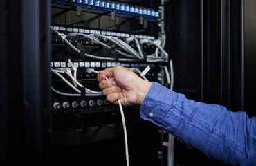 Engineer hands, server room and cable connection for software update or maintenance at night....