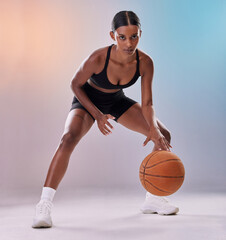 Portrait, basketball player or black woman isolated on gradient background in action, challenge and body workout. Indian person or fitness model in studio training, exercise and ball in focus mindset - obrazy, fototapety, plakaty
