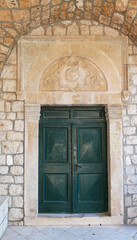 Fototapeta na wymiar View of the closed door at Benedictine Monastery at St Mary's Island, Mljet National Park, Croatia